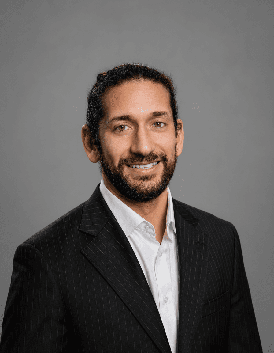 Gregory Stoupe professional headshot, gray background