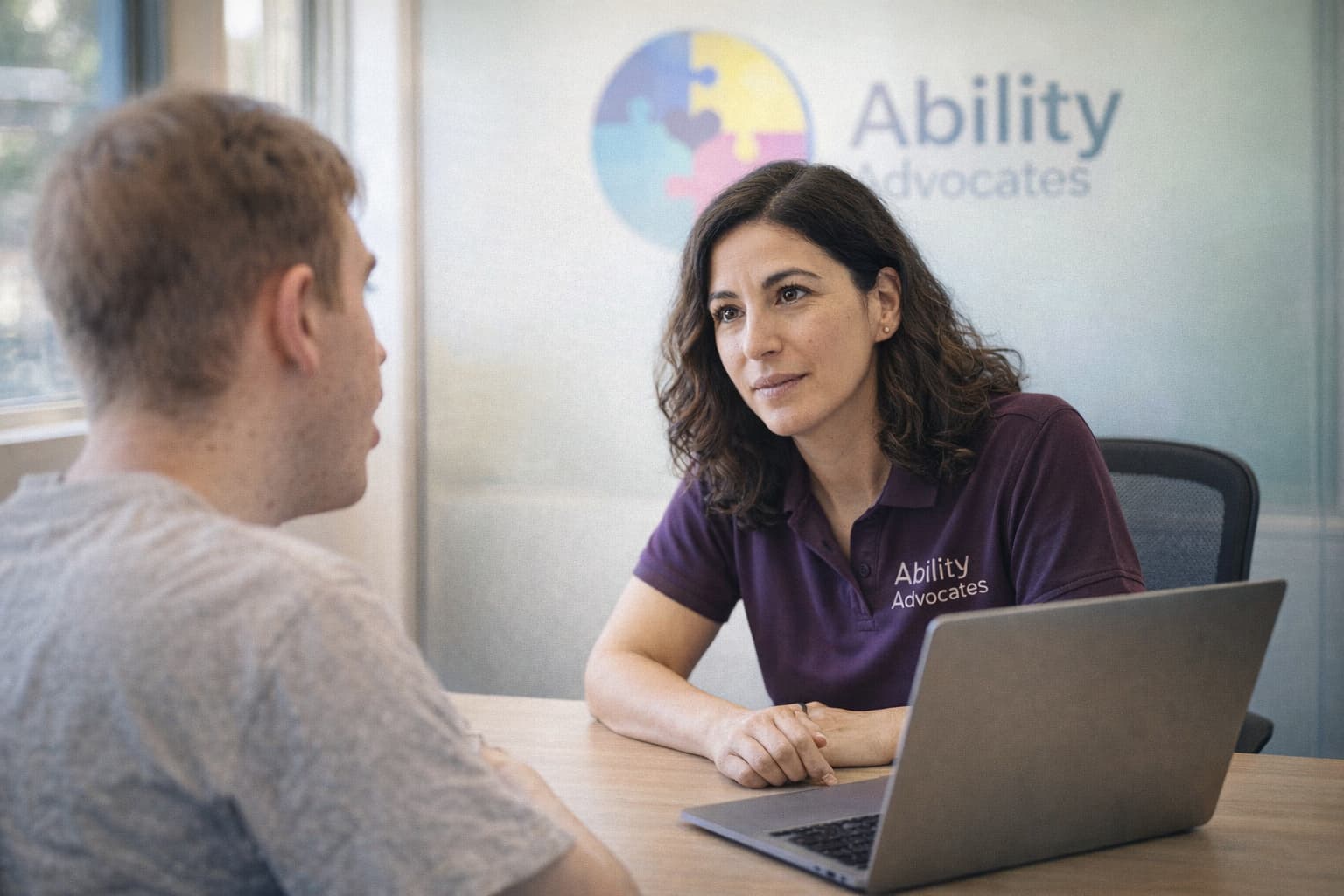 Ability Advocates advocate listening attentively to client in consultation