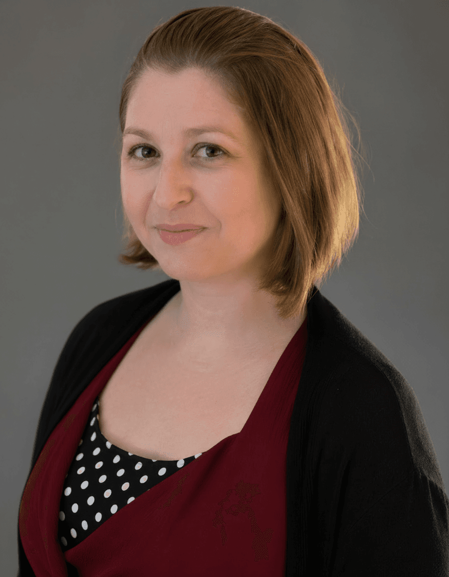 Anne-Charlotte Le Corno professional headshot, gray background